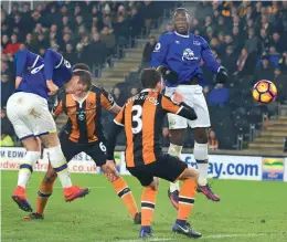  ??  ?? Everton’s Ross Barkley (left) scores against Hull City in their English Premier League match at the KCOM Stadium in Kingston upon Hull on Friday. The match ended 2-2.