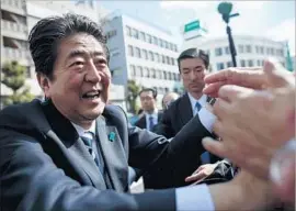  ?? Behrouz Mehri AFP/Getty Images ?? PRIME MINISTER Shinzo Abe’s party has been beleaguere­d by scandals, but he called a snap election Sunday anyway — because the opposition is in disarray.