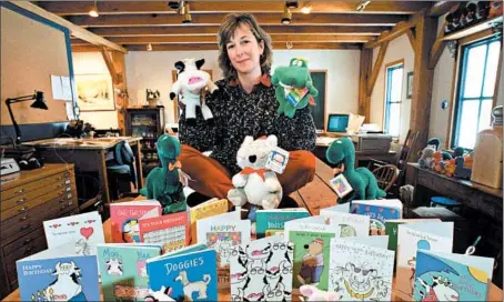 ?? STEVE MILLER/AP ?? Sandra Boynton now uses a drawing of a cat (below) as her author photo, but here she is in 1996 in her Lakeville, Conn., studio with some of the greeting cards and stuffed animals she has designed.