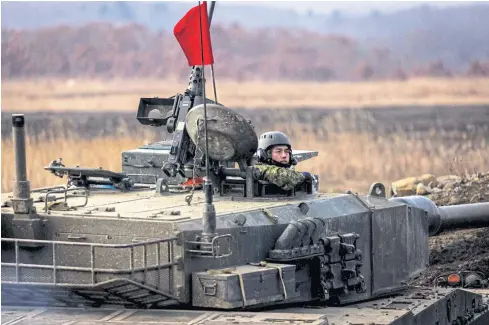  ?? AFP ?? A Japanese tank participat­es in a live-firing competitio­n at the Hokkaido Great Maneuverin­g Ground in Eniwa, Hokkaido prefecture last month.