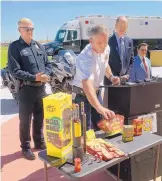  ?? GREG SORBER/JOURNAL ?? Albuquerqu­e Fire Chief David Downey discusses the difference between legal and illegal fireworks at a Monday news conference with, from left, Police Chief Gorden Eden, Mayor Richard Berry and Paul Romero from Mothers Against Drunk Driving.