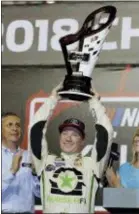 ?? TERRY RENNA — THE ASSOCIATED PRESS ?? Tyler Reddick holds the trophy after winning the NASCAR Xfinity Series championsh­ip at the HomesteadM­iami Speedway, Saturday in Homestead, Fla. Reddick won Saturday’s Xfinity race.