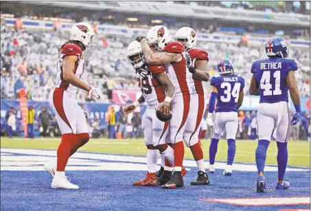  ?? Adam Hunger / Associated Press ?? The Cardinals’ Chase Edmonds (29) celebrates his touchdown during the second half against the Giants on Sunday.