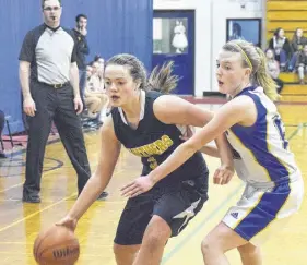  ?? JOEY SMITH/TRURO NEWS ?? Jewel Woolfitt of the Truro Panthers drives on Dara Mccabe of Stone Park, P.E.I., during action at the CEC leadership junior girls basketball tournament last week.