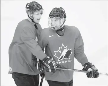  ?? Larry Macdougal/the Canadian Press ?? Ryan Strome, left, and 17-year-old Jonathan Drouin get their first taste of action in a pre-competitio­n game Thursday against Finland. Drouin is pencilled in to play on the second line with Strome and Brett Ritchie.