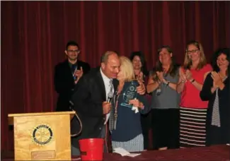  ?? CHARLES PRITCHARD - ONEIDA DAILY DISPATCH ?? Carol Madonia accepts the Bill Fariel Award for Vocational Excellence from Hank Leo on Oct. 24