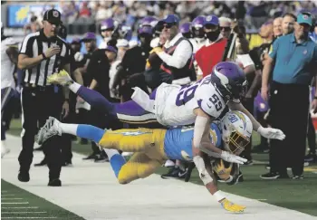  ?? AP PHOTO/MARCIO JOSE SANCHEZ ?? Minnesota Vikings outside linebacker Nick Vigil (59) tackles Los Angeles Chargers running back Austin Ekeler (30) during the first half of an NFL football game on Sunday in Inglewood, Calif.