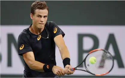  ??  ?? INDIAN WELLS: Vasek Pospisil of Canada plays a backhand during his straight sets victory against Andy Murray of Great Britain in their second round match during day six of the BNP Paribas Open at Indian Wells Tennis Garden on Saturday in Indian Wells,...