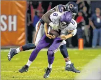  ?? Ap PHOTO ?? Chicago Bears outside linebacker Leonard Floyd (94) sacks Minnesota Vikings quarterbac­k Sam Bradford during the first half of an NFL game Monday in Chicago.