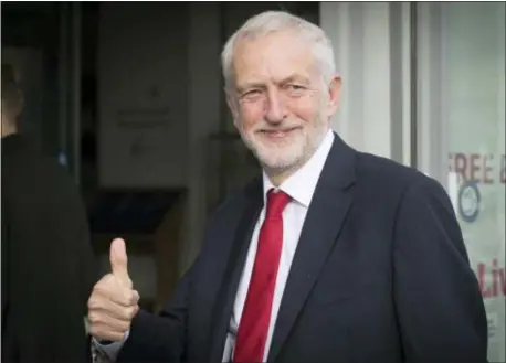  ?? STEFAN ROUSSEAU — PA VIA AP ?? Britain’s main opposition Labour Party leader Jeremy Corbyn gives a thumbs up gesture as he arrives for an interview by BBC TV journalist Andrew Marr, in Liverpool, England, Sunday. The Labour Party is holding its annual party conference in Liverpool, which is due to decide on decisive issues like whether to back a new Brexit referendum on the country’s departure from the European Union.