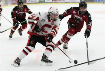  ?? CITIZEN PHOTO BY JAMES DOYLE ?? Cariboo Cougars forward Grady Thomas throws a backhander on net against the Valley West Giants on Sunday morning at Kin 1. The Cougars won 3-1 after the teams tied 3-3 on Saturday night.