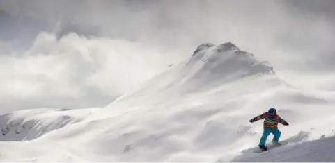  ?? TODD KOROL FOR THE TORONTO STAR ?? A snowboarde­r rides the backcountr­y snow at Sunshine ski resort in Banff National Park. It’s one of Thomas Grandi’s favourite places to ski.