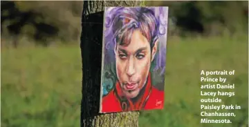  ??  ?? A portrait of Prince by artist Daniel Lacey hangs outside Paisley Park in Chanhassen, Minnesota.