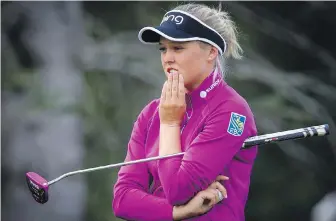  ??  ?? Brooke Henderson keeps a close eye on her foursome during the pro-am at the Canadian Pacific Open in Calgary on Wednesday. The Ontario native is looking for her third win.