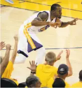  ?? Carlos Avila Gonzalez / The Chronicle ?? Andre Iguodala celebrates after making a three- point shot during the first half. The Warriors’ sixth man had eight points, five rebounds, two assists and three steals in 30 minutes.