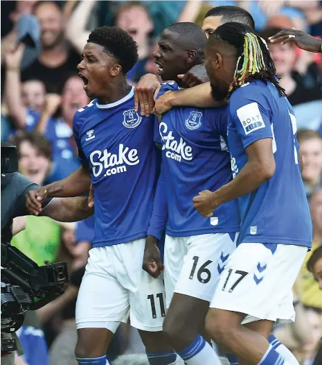  ?? AFP ?? Everton’s Abdoulaye Doucoure celebrates with teammates after scoring the winner for Everton against Bournemout­h