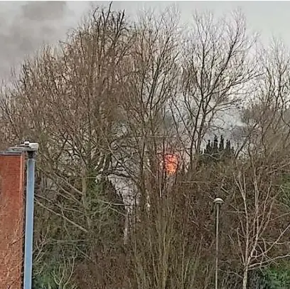 ?? ?? ●●Smoke billowing from the scene at Heald Green earlier this morning