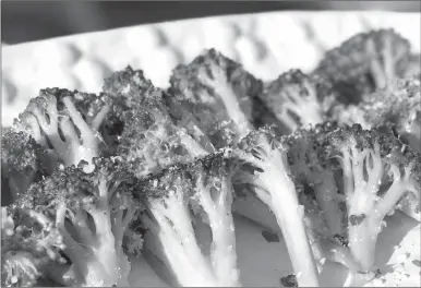  ?? Associated Press photo ?? This photo shows weekday sauteed broccoli in Bethesda, Md. This recipe for weekday side dish calls for broccoli but you could easily substitute cauliflowe­r or carrots or asparagus, depending on what’s in season or what’s on sale or what’s hanging out...