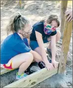  ??  ?? Teamwork is essential in Scouting. Parents helped their Scouts, and Scouts helped each other, in building the projects in Pea Ridge’s City Park. (Courtesy Photos)