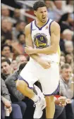  ?? DAVID J. PHILLIP— ASSOCIATED PRESS ?? Klay Thompson (28points) reacts after making a 3-pointer.