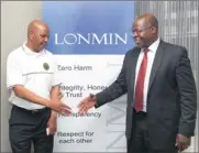  ?? PHOTO: SIMPHIWE MBOKAZI ?? Amcu president Joseph Mathunjwa, left, and Lonmin chief executive Ben Magara shake hands yesterday to seal a historic recognitio­n agreement after protracted talks.