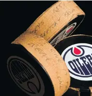  ?? POSTMEDIA NEWS ?? A puck labelled “This one is the real one” is pictured along with two other pucks from the night that Wayne Gretzky scored his record-setting 1,851st NHL point.