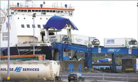  ?? PETER MORRISON AP ?? Heavy-goods vehicles arrive from Scotland at the P&O ferry terminal in the port at Larne, on the north coast of Northern Ireland, on Friday, the first day after the United Kingdom's split with the European bloc's vast single market for people, goods and services.