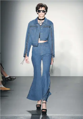  ?? BRIAN ACH/GETTY IMAGES ?? This 1970s-inspired denim outfit modelled at the Concept Korea show during New York Fashion Week in September is an example of the way the fashion industry puts a new twist on old designs.