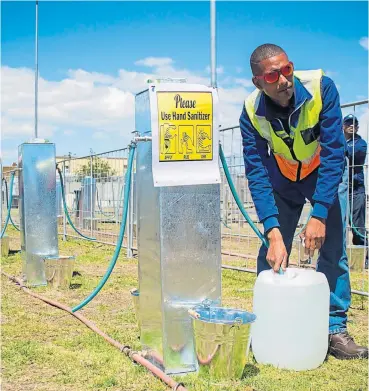  ?? /Anthony Molyneaux ?? Precious resource: Brandon Herringer, a City of Cape Town plumber, test-drives one of the water points the city had mapped out in the event of Day Zero. Thankfully, that day did not arrive, though Cape Town still faces a water-scarce future.