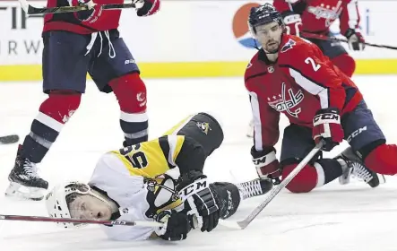  ?? PATRICK SMITH/GETTY IMAGES ?? Jake Guentzel, left, and the Pittsburgh Penguins fell flat in their attempt to take a 2-0 series lead over Matt Niskanen and the Capitals Sunday as Washington scored three straight goals in a 4-1 win.