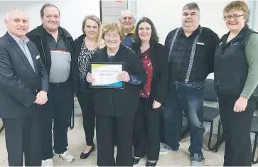  ??  ?? Julia Ettery receiving CCG life membership with (from left): board co-chair Des Williams, and her family members, Kevin, Alicia, Ron and Marianne Ettery and Chris York, and CCG chief executive Sue Geals.