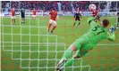  ?? Photograph: Markus Gilliar/Getty ?? Vincenzo Grifo of Freiburg scores his team’s first goal in the 3-0 defeat of Hertha Berlin, who were left in deep relegation trouble.