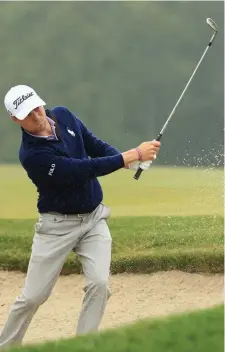  ??  ?? LEADER IN THE CLUBHOUSE: Justin Thomas, the FedEx Cup leader so far this season, plays a shot from the bunker on the 13th hole during the Dell Technologi­es Championsh­ip at TPC Boston in September 2017.