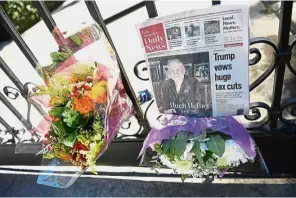  ??  ?? Tributes to an icon: Flowers placed at the gate of the Playboy Mansion in remembranc­e of Hefner. — AFP