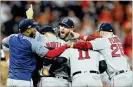  ?? ELSA / GETTY IMAGES ?? Red Sox ace Chris Sale and his Boston teammates rejoice after dispatchin­g defending World Series champion Houston in five games.