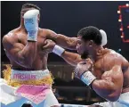  ?? | PHOTO : REUTERS ?? Anthony Joshua (à droite).