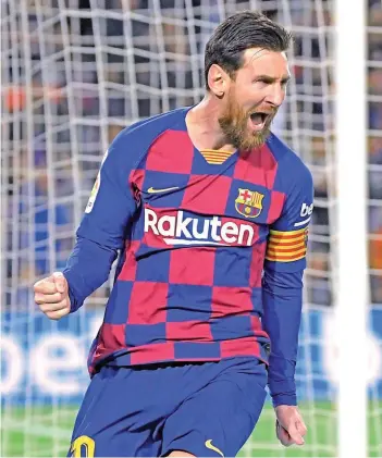  ?? — AFP ?? In this file photo taken on March 07, 2020 Barcelona’s Lionel Messi celebrates after scoring a goal during the Spanish league match against Real Sociedad at the Camp Nou stadium in Barcelona.