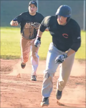  ?? JASON MALLOY/THE GUARDIAN ?? The Alley Stratford Athletics shortstop Jonny Arsenault, left, has Logan Gallant caught in a rundown during Kings County Baseball League action Wednesday in Stratford. Gallant stayed alive long enough to ensure a runner scored from third base.