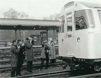  ??  ?? Photograph­ers capture a freshly delivered 1967 Stock train using Automatic Train Operation at Woodford in 1968.