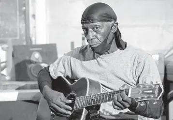  ?? ROGELIO V. SOLIS/AP ?? Bluesman Jimmy “Duck” Holmes plays a quick ditty on Jan. 21 at the Blue Front Cafe in Bentonia, Mississipp­i.