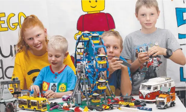  ?? Picture: ANNA ROGERS ?? LEGO LOVERS: Jordyn Rowe, 14, Dexter Rutten, 4, Chad Rutten, 8, and Finlay Curnuck, 8, are getting ready for the Cairns Lego Buildapalo­osa.