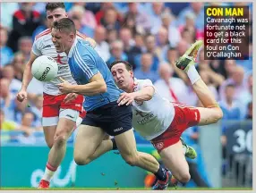  ??  ?? CON MAN Cavanagh was fortunate not to get a black card for this foul on Con O’callaghan