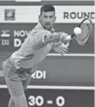  ?? JAYNE KAMIN-ONCEA/USA TODAY SPORTS ?? Novak Djokovic hits a shot against Luca Nardi during a BNP Paribas Open match March 11 in Indian Wells, Calif.