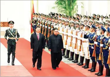  ?? KCNA VIA KNS/AFP ?? North Korean leader Kim Jong-un inspects an honour guard while accompanie­d by Chinese President Xi Jinping during a welcoming ceremony at the Great Hall of the People in Beijing on Tuesday.