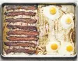  ?? ANDREW PURCELL/NEW YORK TIMES ?? Crispy oven bacon and eggs.