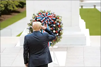  ?? ANNA MONEYMAKER/THE NEW YORK TIMES ?? President Trump salutes in a Memorial Day event at the Tomb of the Unknown Soldier at Arlington National Cemetery.