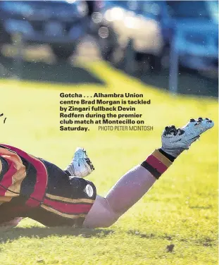  ?? PHOTO PETER MCINTOSH ?? Gotcha . . . Alhambra Union centre Brad Morgan is tackled by Zingari fullback Devin Redfern during the premier club match at Montecillo on Saturday.