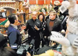  ?? Keith Srakocic ?? The Associated Press Republican Rick Saccone, right, and Donald Trump Jr. listen Monday to retail operations manager Norm Candelore as they go on a tour of Sarris Candies while on a campaign stop in Canonsburg, Pa. Saccone is running against...