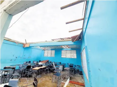  ?? ?? A classroom with the roof completely torn during the passage of Hurricane Beryl on Wednesday, July 3, 2024.