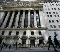  ?? MARY ALTAFFER — THE ASSOCIATED PRESS FILE ?? In this March 23, 2021 file photo, pedestrian­s walk past the New York Stock Exchange in New York’s Financial District.